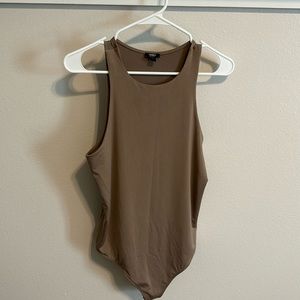 Express body contour sleeveless thong body suit. Size large. Color taupe.